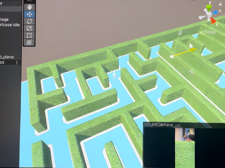 Unity 2022 editor open on a laptop showing the 3D hedge maze scene with green walls and a player-camera ARCamera preview.