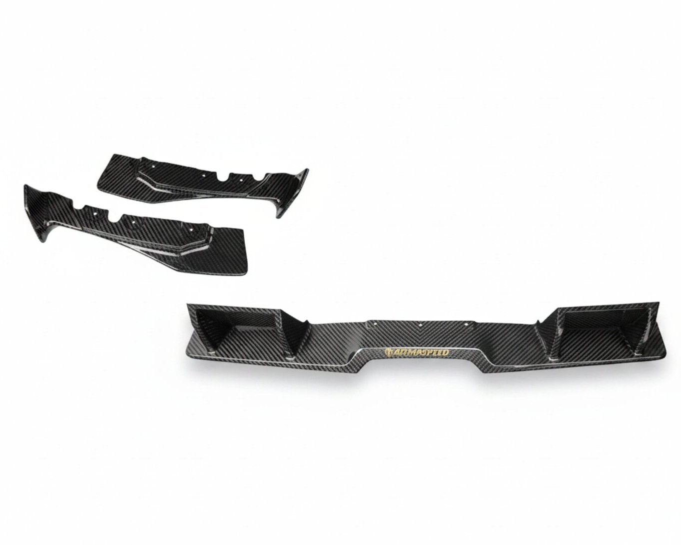 First carbon fiber samples of three rear diffuser pieces, in studio lighting.