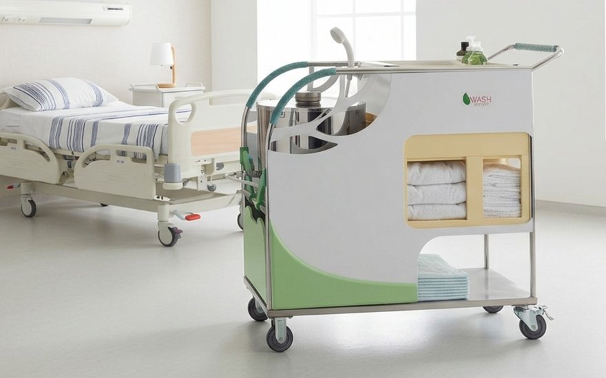 Wash Enjoy bath-assistance cart, side view in a hospital room.