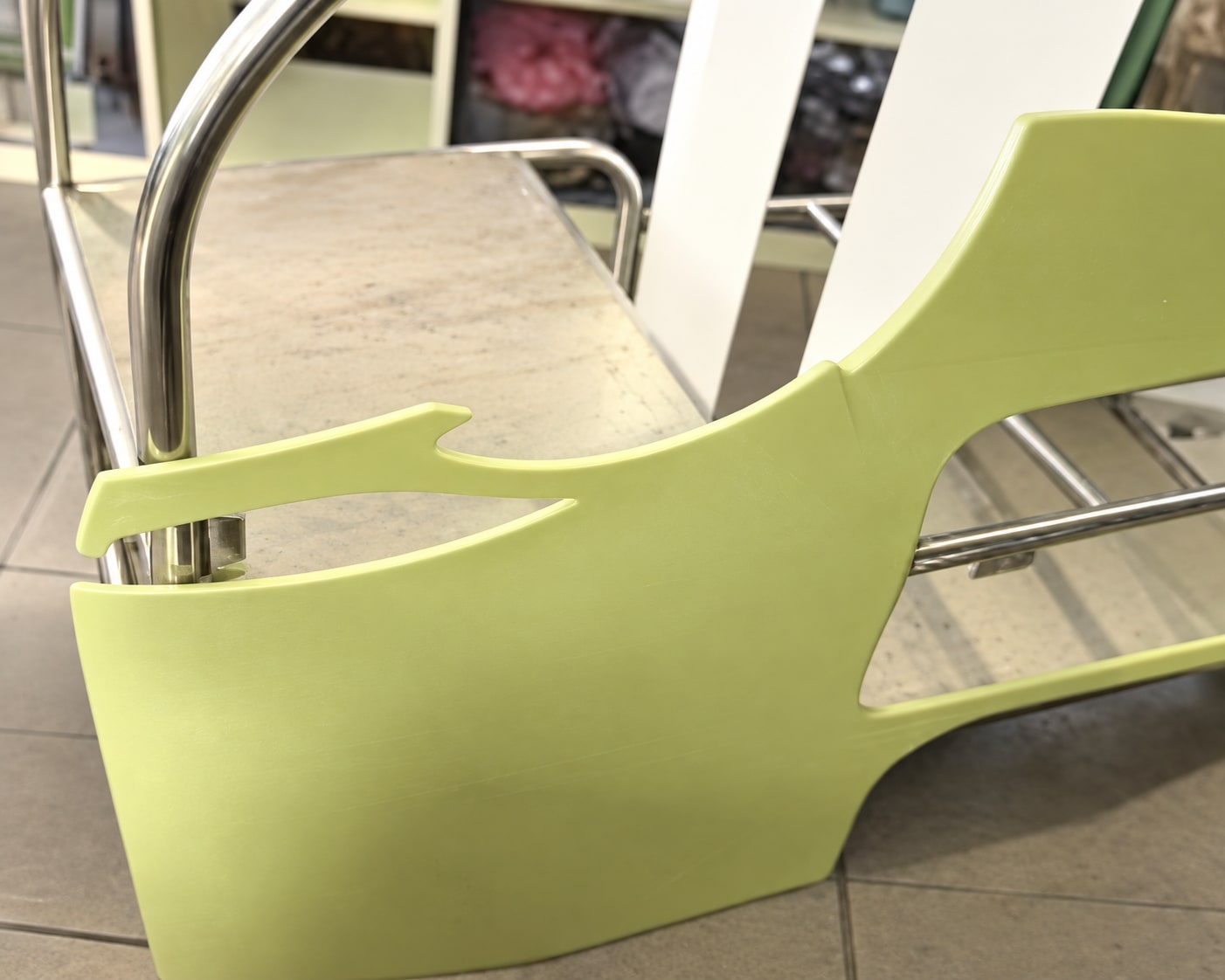 AI reconstruction of the original close-up: yellow-green ABS body panels fitted to the stainless tube frame.