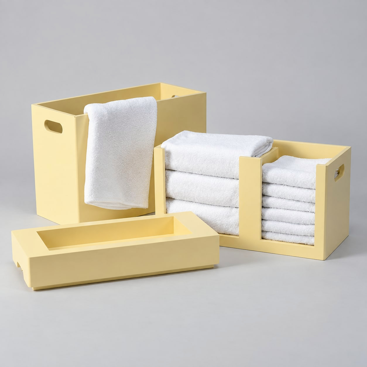 Detail: three yellow towel storage boxes with white folded towels.