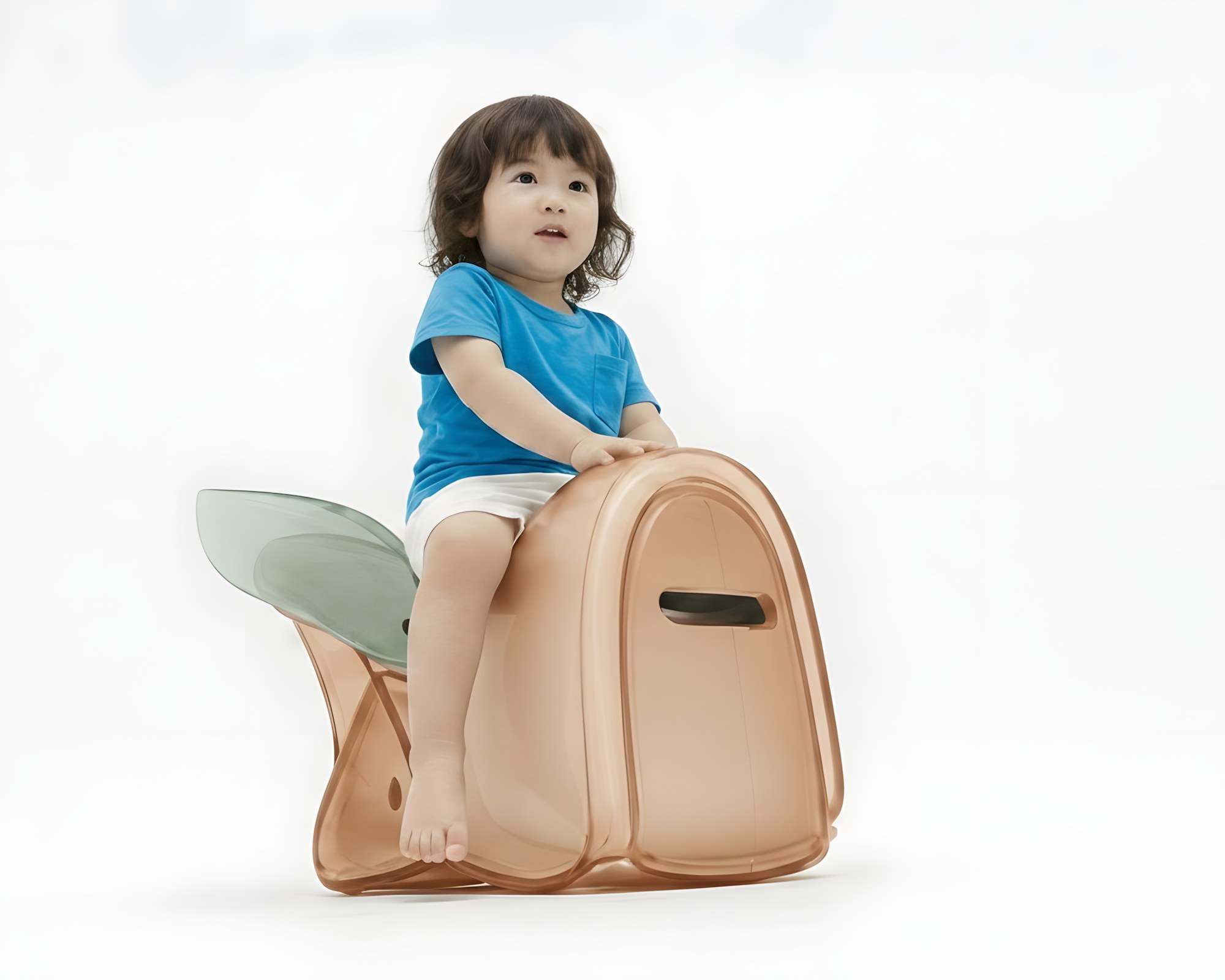 A young child sits on the apricot body with green wing colorway of the cicada chair, hand resting on the wing flange — the chair's two behaviors (sit-on and strike) embodied in one image.